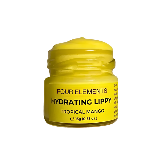 A yellow jar of Four Elements Hydrating Lip Butter with the label Tropical Mango visible on the lid.