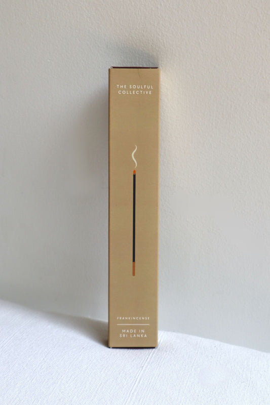 Incense packaging with 'The Soulful Collective' branding on a white surface.