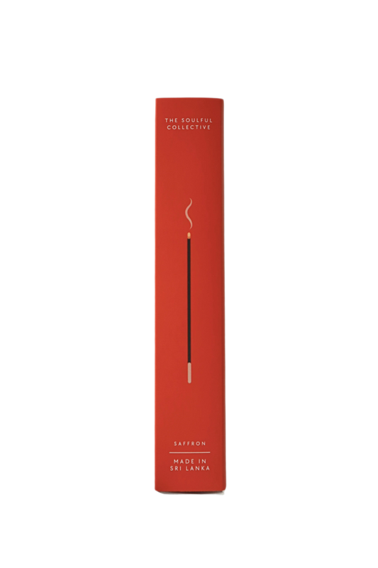 Red candle packaging with 'The Scentual Collective' branding on a white background