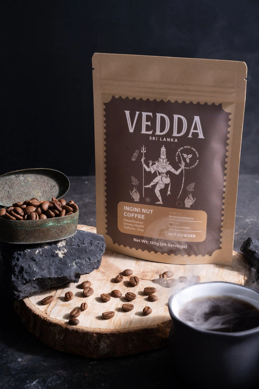 Vedda coffee package with coffee beans and a cup of coffee on a dark background