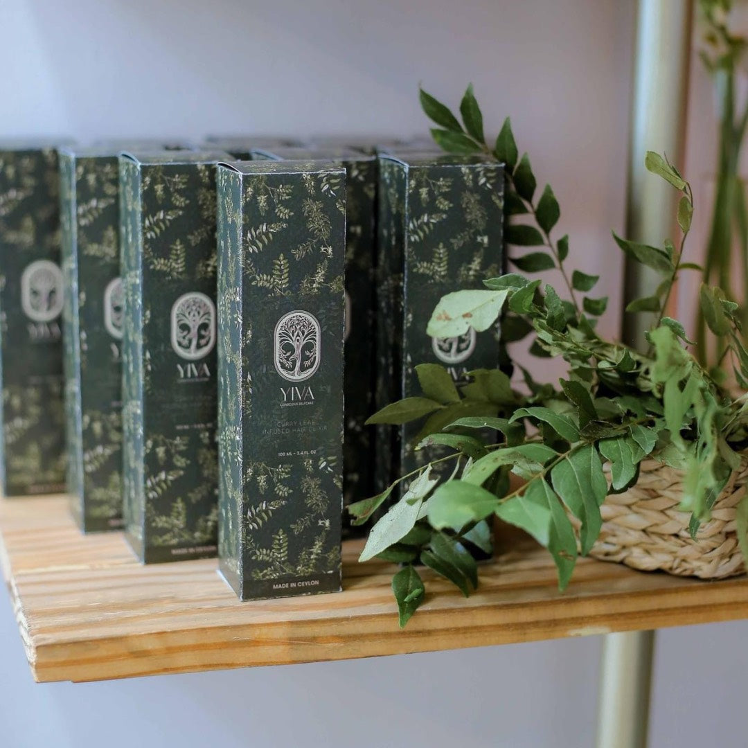 YIVA product boxes on a wooden shelf with plants